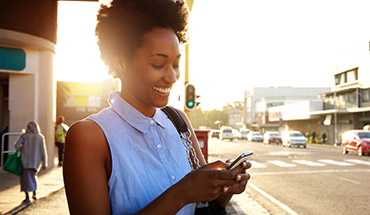 Woman on phone outdoors.