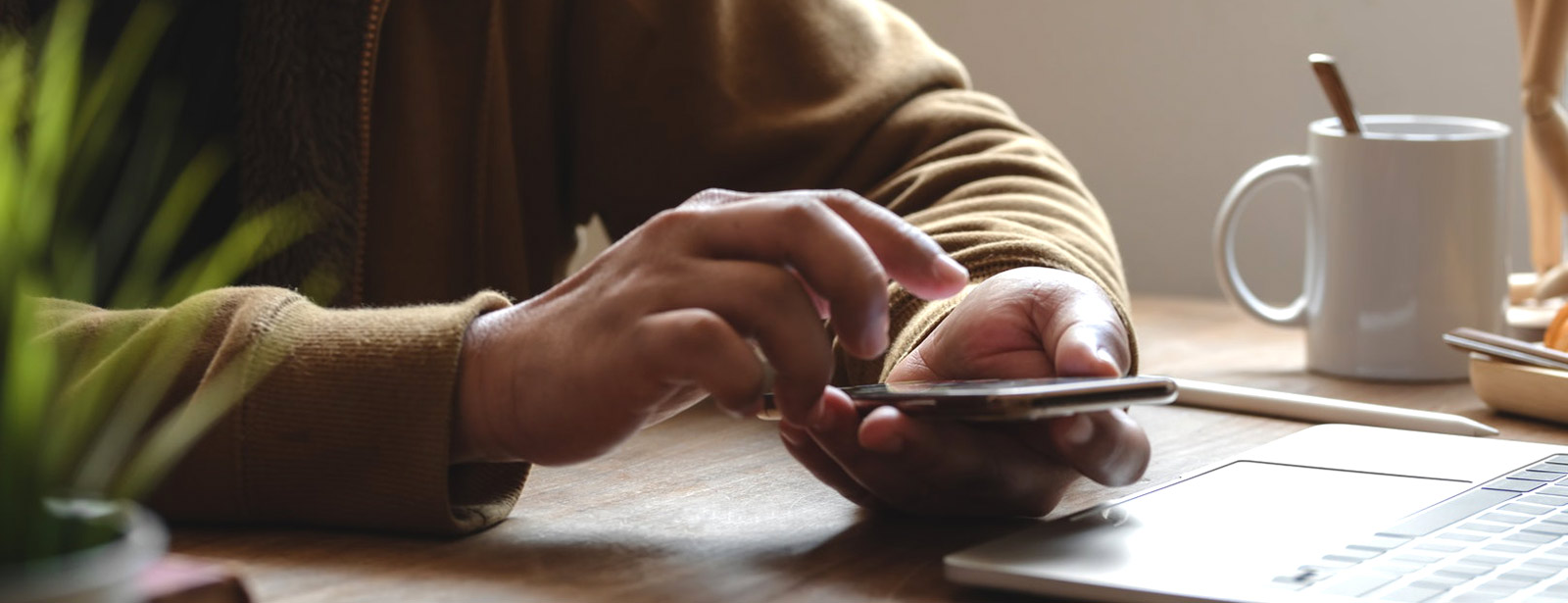 Close up of man using smartphone.